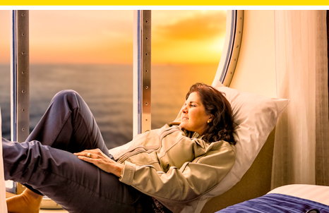 Woman relaxing in bedroom ship