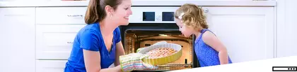 Mother and daugther next to oven