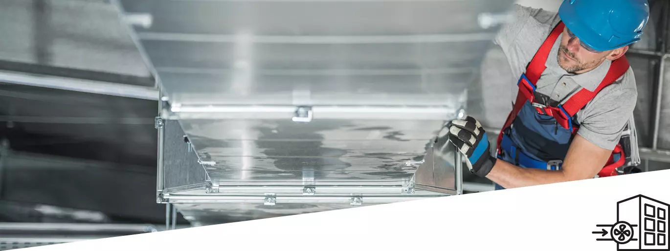 Man insulating an air duct