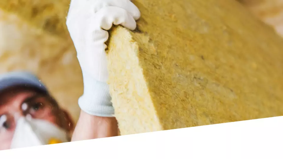 Man working with mineral wool
